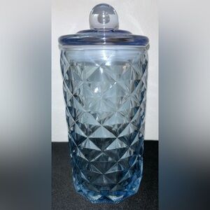 Blue glass jar, diamond pattern w/sealed top. 8.25”